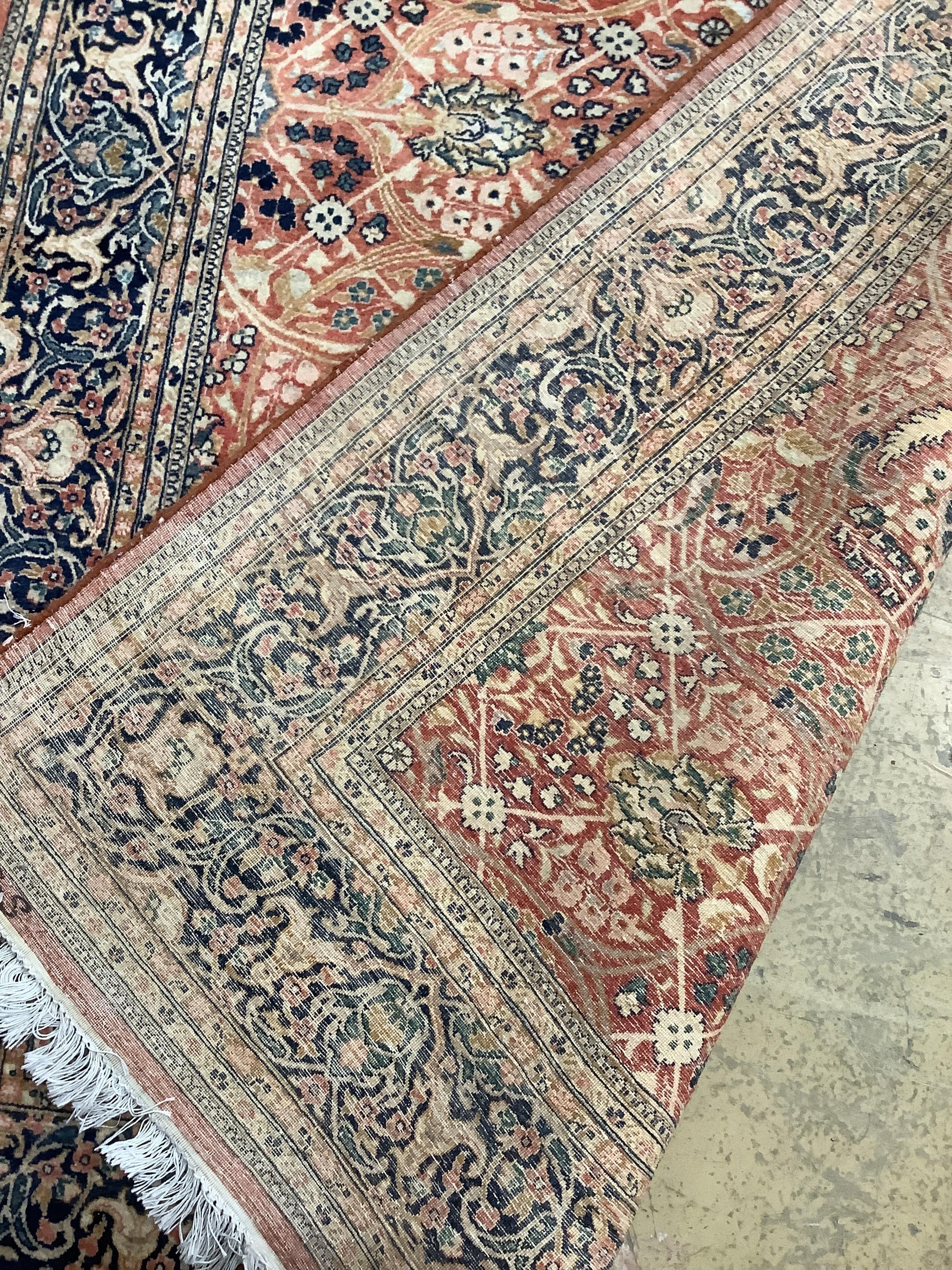 A North West Persian red ground rug, 220 x 137cm